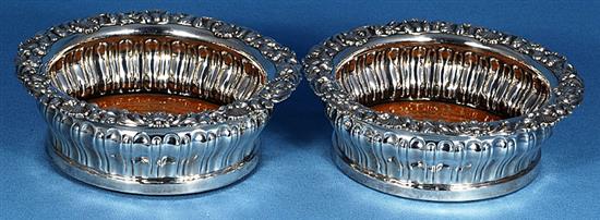 A pair of George IV silver wine coasters, Diameter 6 ¾”/170mm Height 60 Total weight inc bases 19.6ozs/557grs